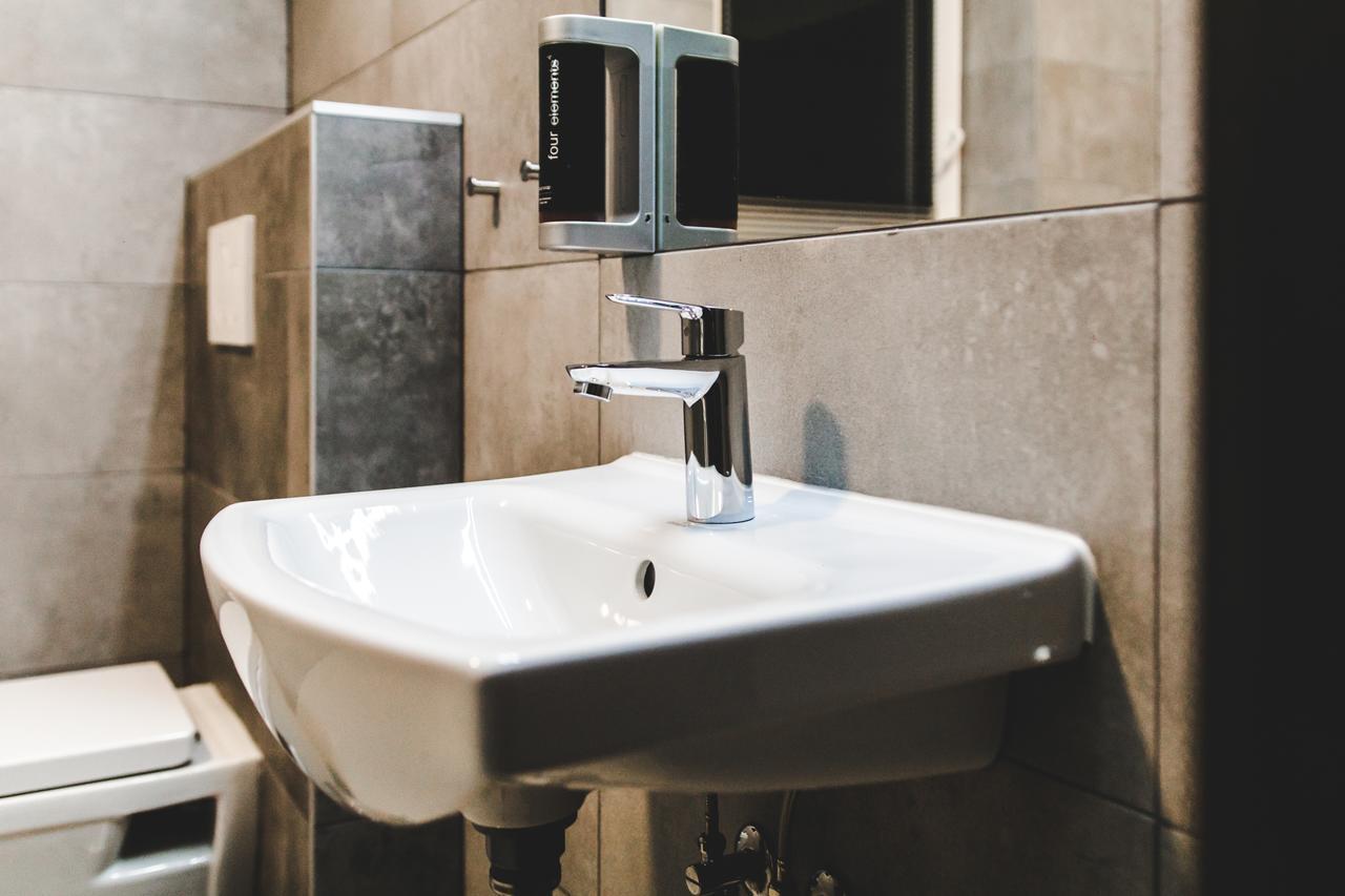 Silesia Residence ออสตราวา ภายนอก รูปภาพ A soap dispenser mounted above a sink